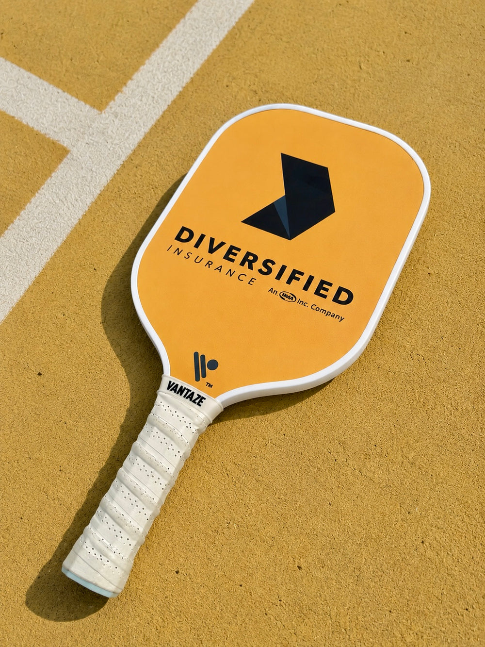 Custom Diversified pickleball paddle made by Vantaze for a corporate custom paddle project