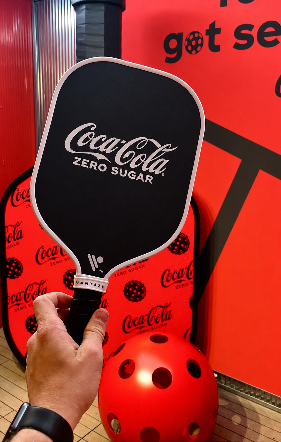Custom Coca-Cola pickleball paddle made by Vantaze for a branded corporate project